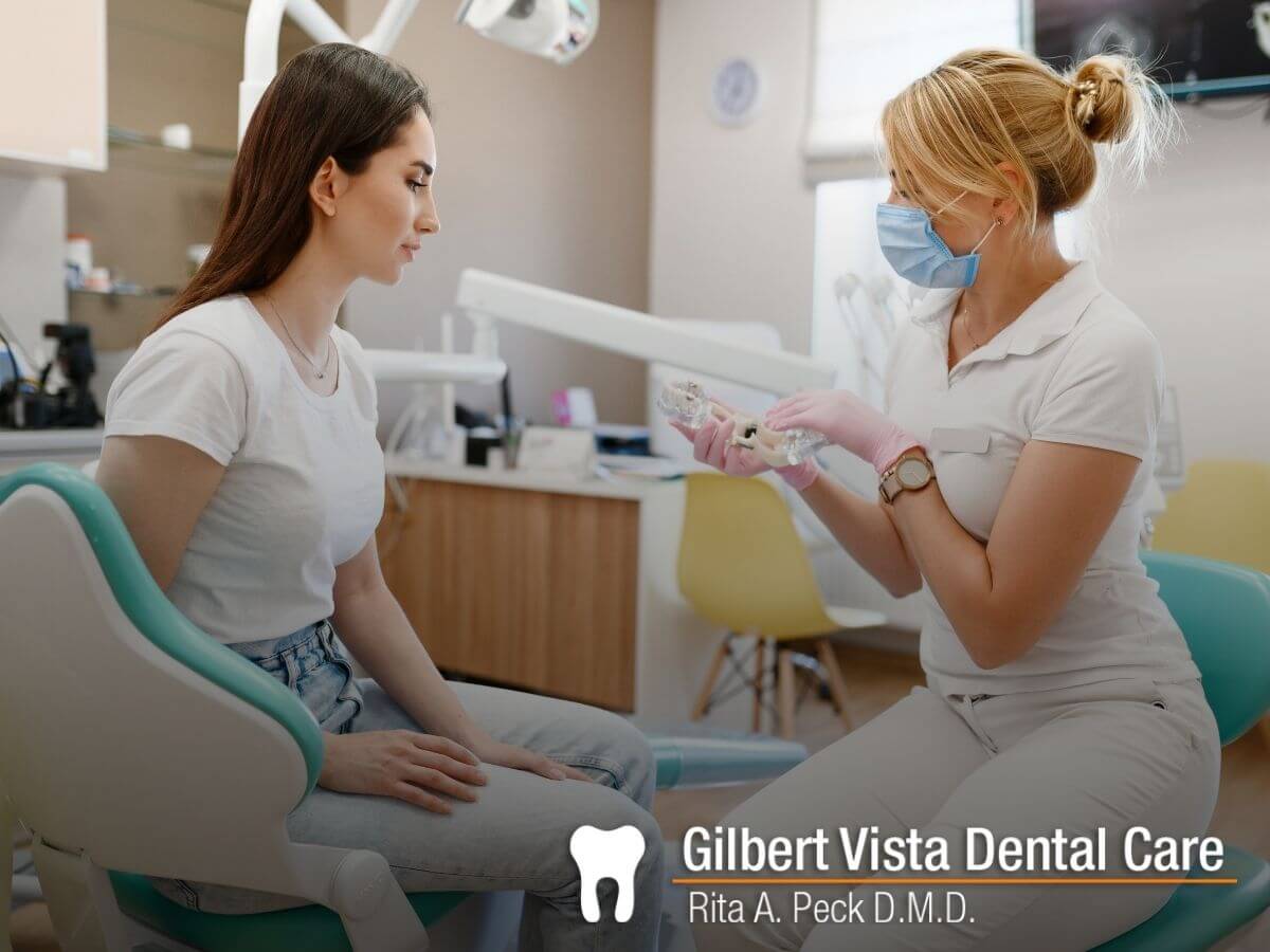 Gilbert dentist explains about Crown Lengthening to a woman