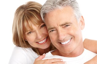 Couple enjoying healthy teeth after dental fillings and root canal treatment