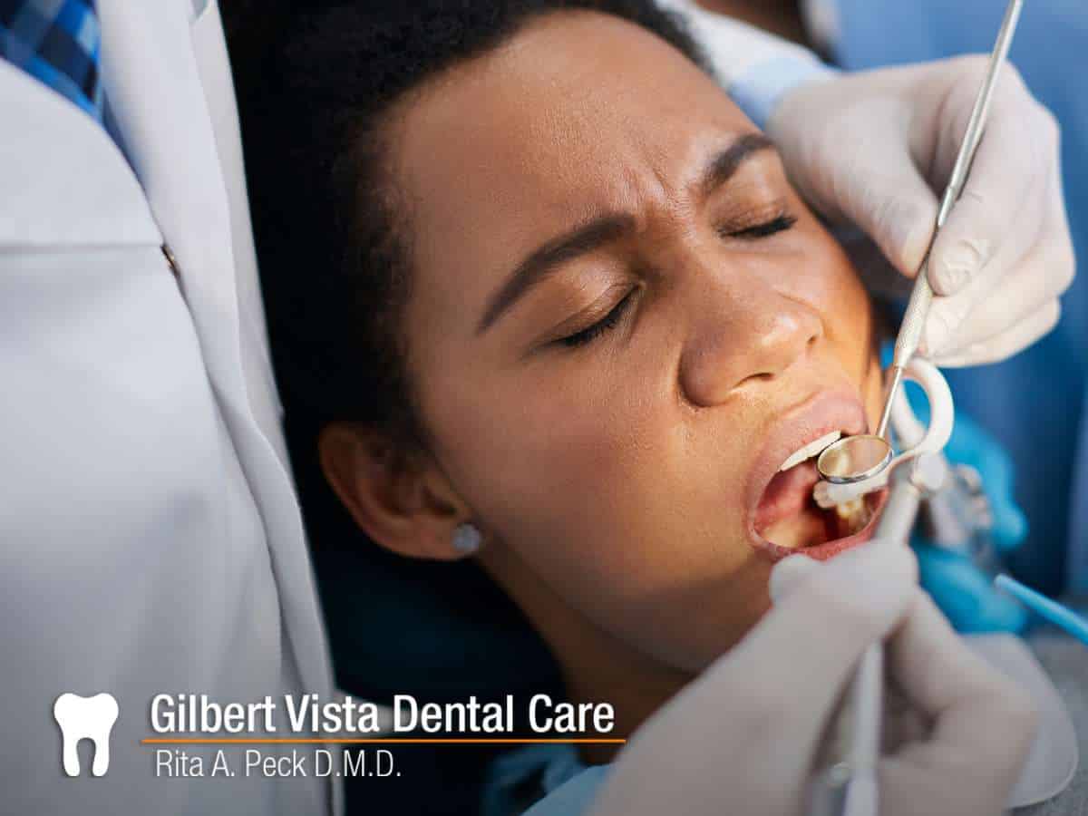 A girl preventing a tooth abscess with proper care at Gilbert Vista Dental Care